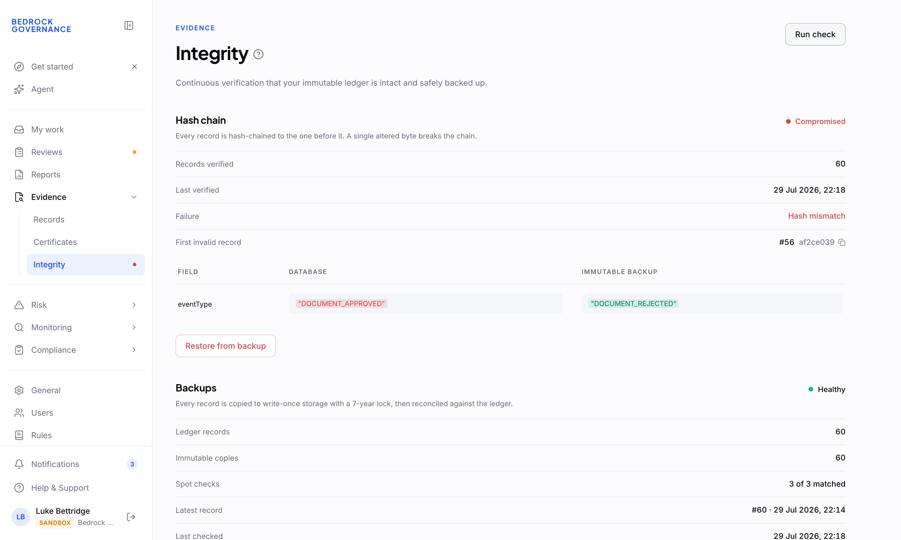 An integrity check that has caught a tampered record, where a rejected decision was altered to approved in the database, against the true value in the immutable backup